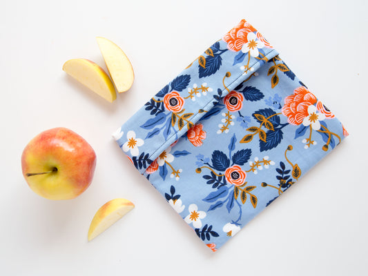 Blue snack bag with flowers on it.