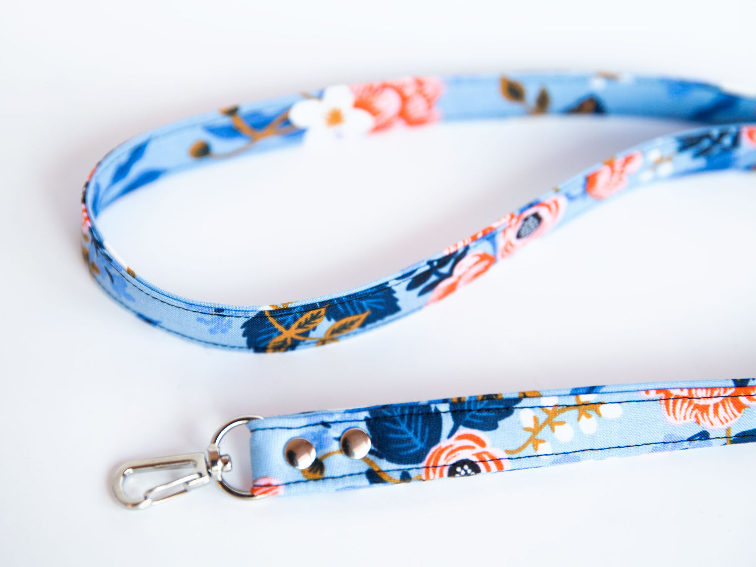 Blue floral lanyard laying on a table