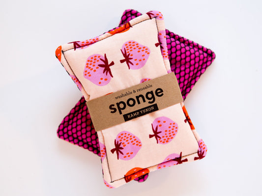 Pink strawberries on a fabric sponge with a bright pink mesh backing