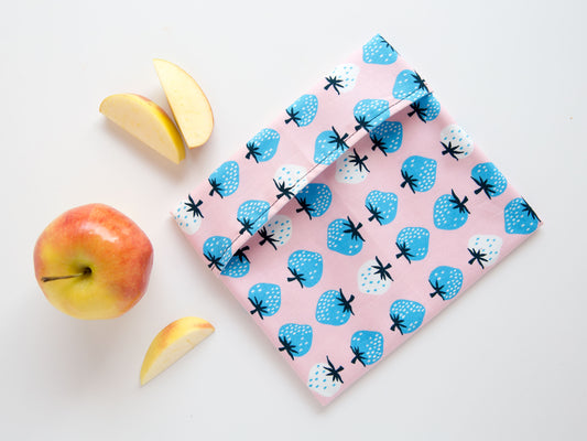 Snack bag with blue strawberries on it.