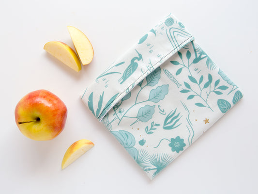 white snack bag with teal leaves