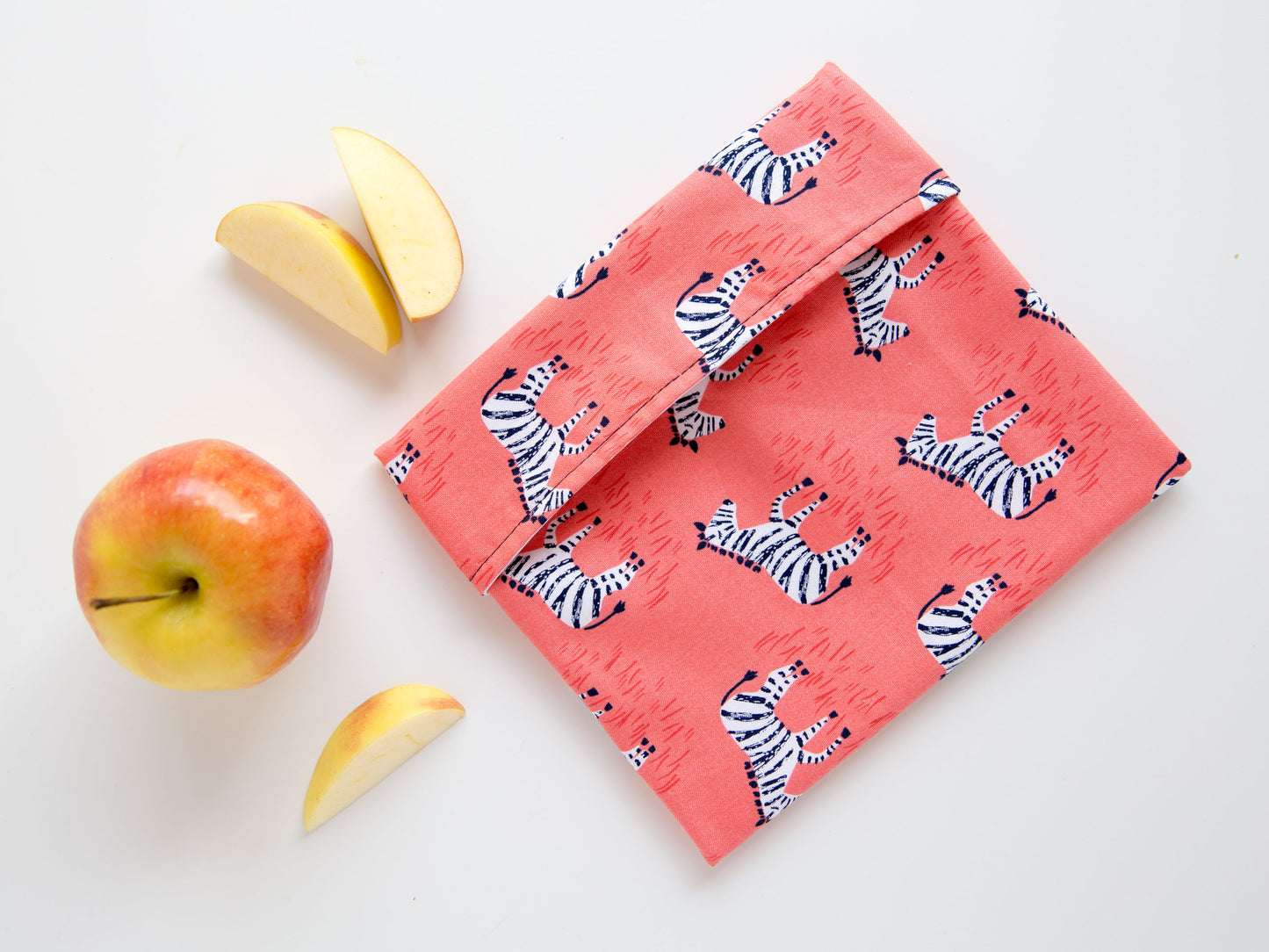 snack bag with zebras on a pink background