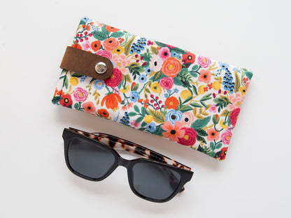 Sunglasses and a floral glasses case
