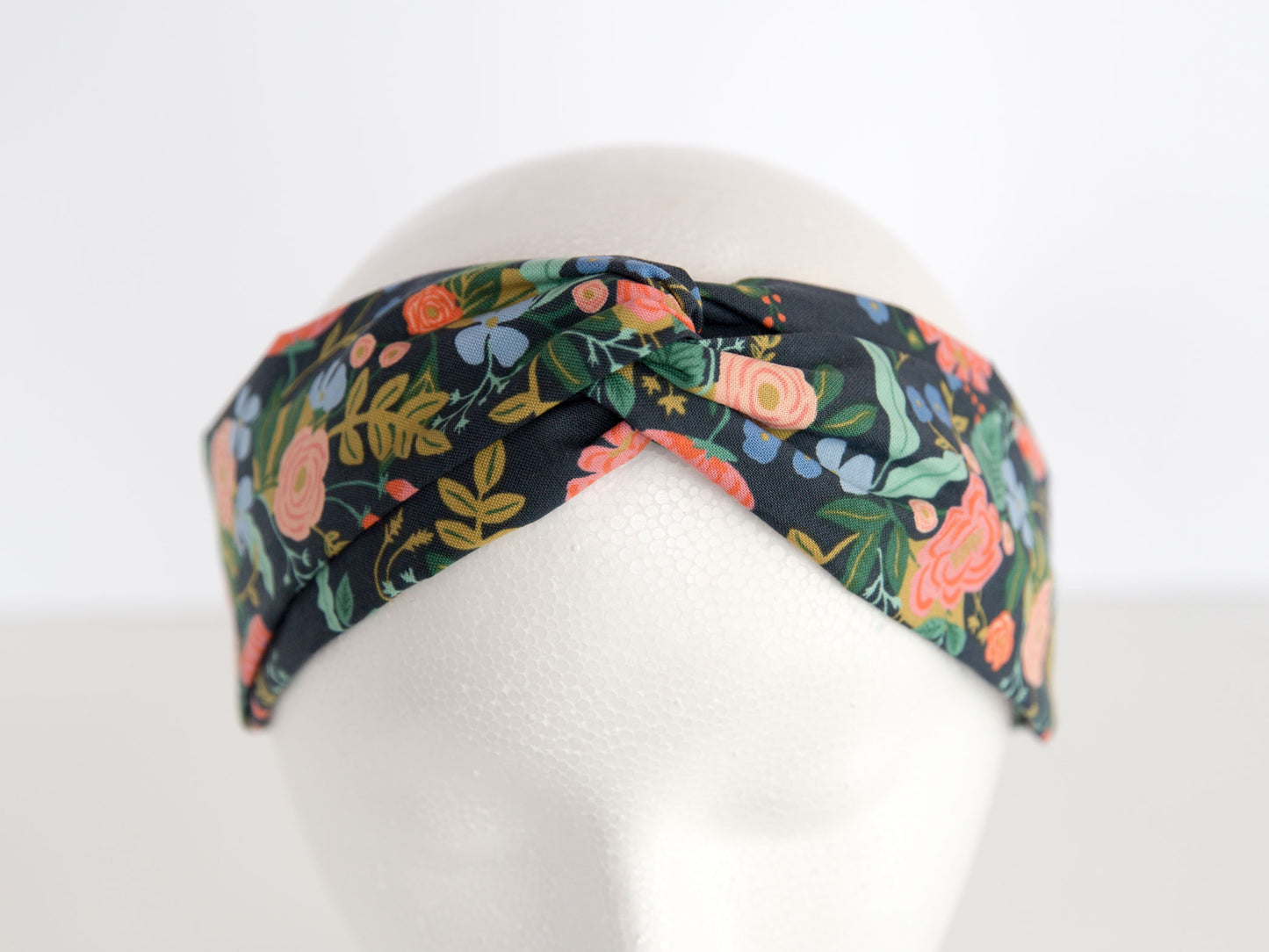 navy rifle paper floral headband on a mannequin