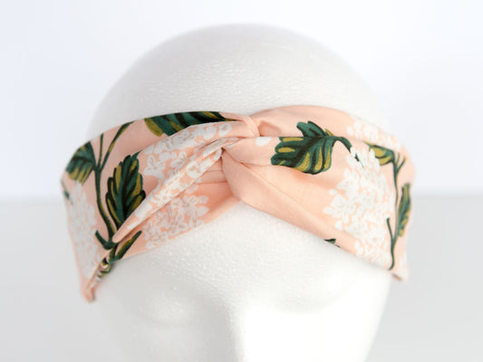 pink rifle paper floral headband on a mannequin