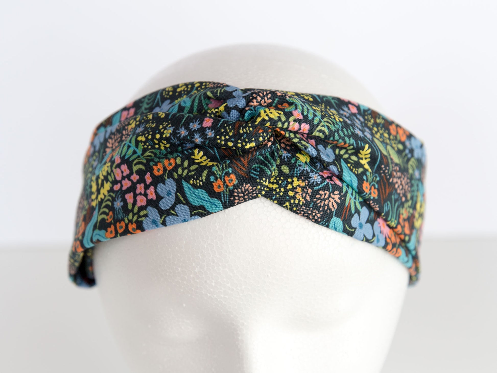 black rifle paper floral headband on a mannequin