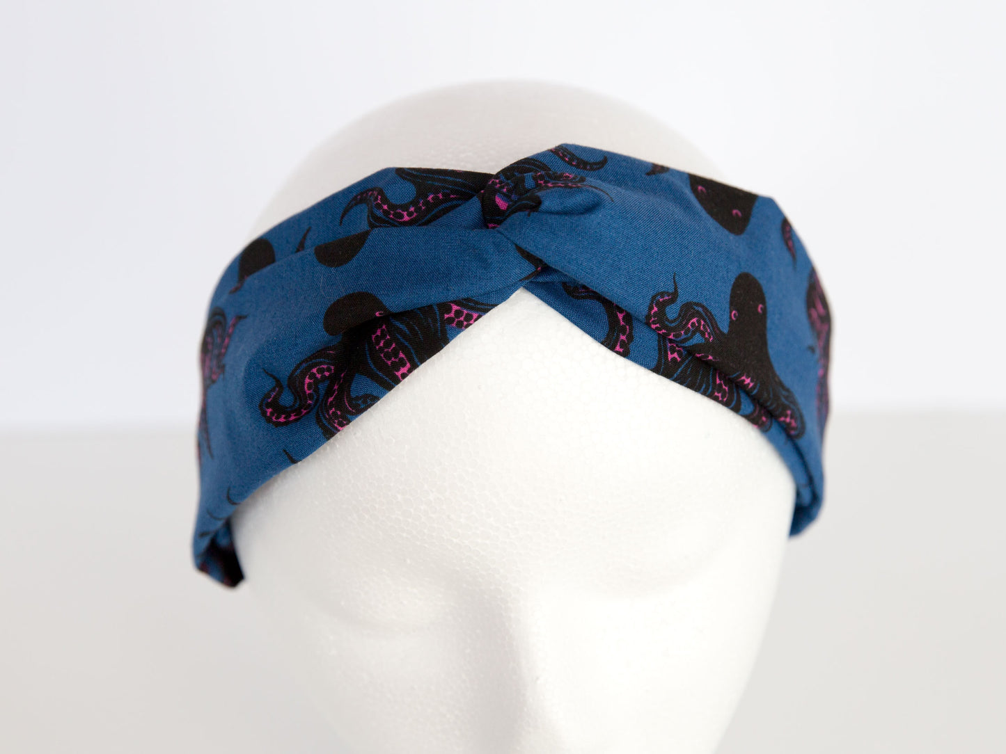 navy headband with octopus on a mannequin