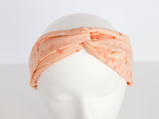 light pink headband on a mannequin