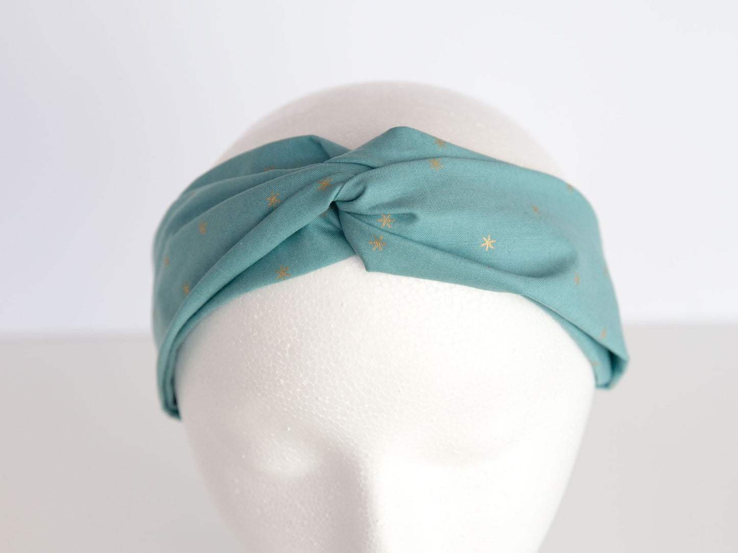sage and star headband on a mannequin